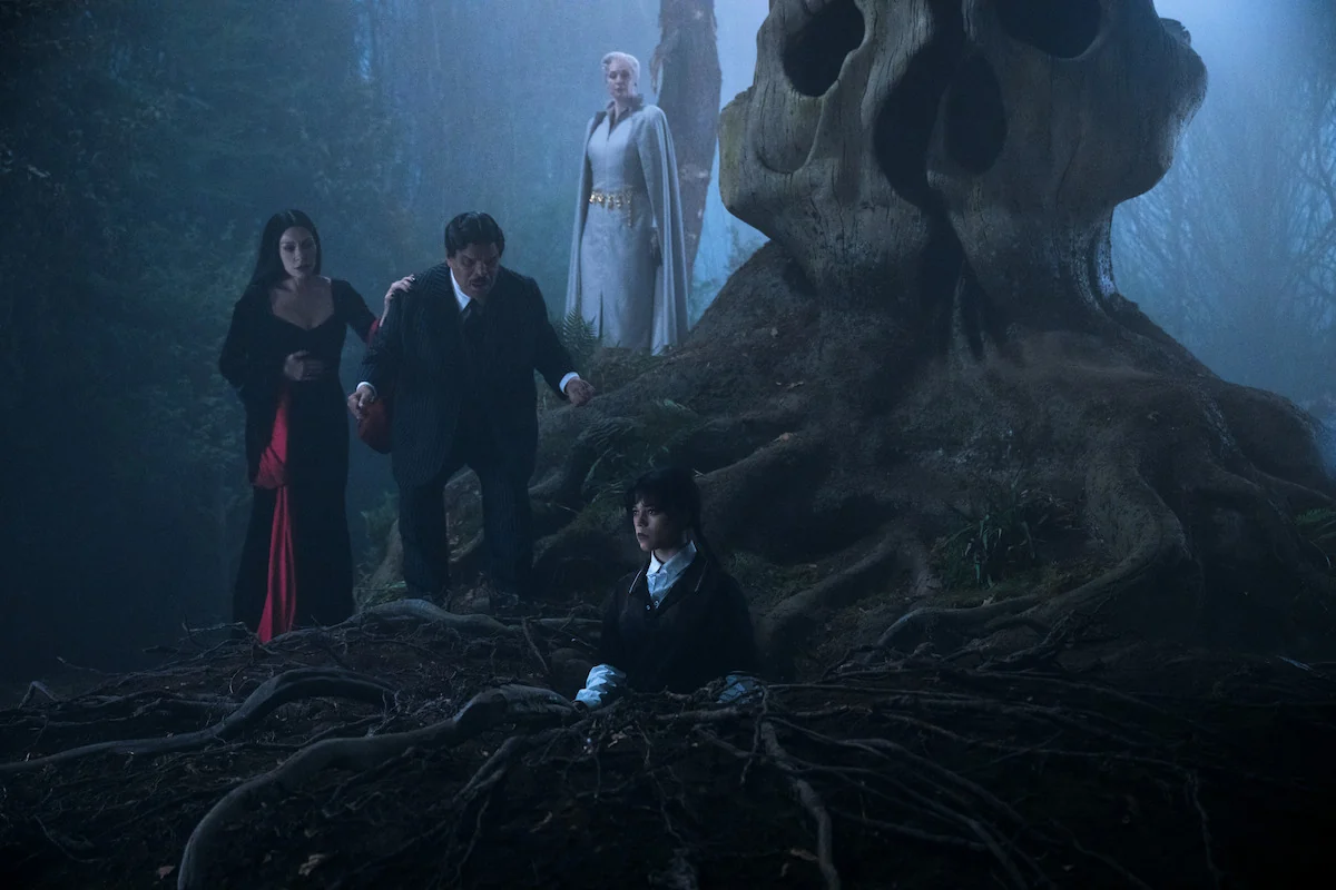Gwendoline Christie as Principal Weems with Morticia, Gomez and Wednesday Addams in a Wednesday Season 2 still