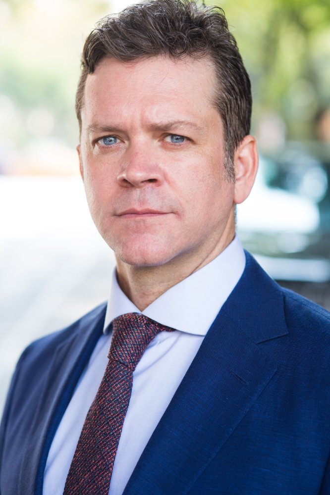 Tom O'Keefe as Jim Martin in FBI: Most Wanted