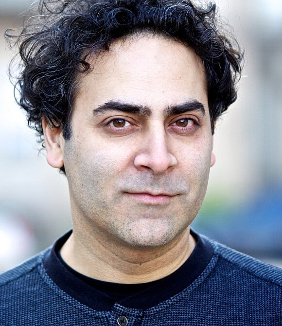 Cyber Intelligence Specialist Ernie Malik character from NCIS TV series Cyber Intelligence Specialist Ernie Malik character from NCIS TV series